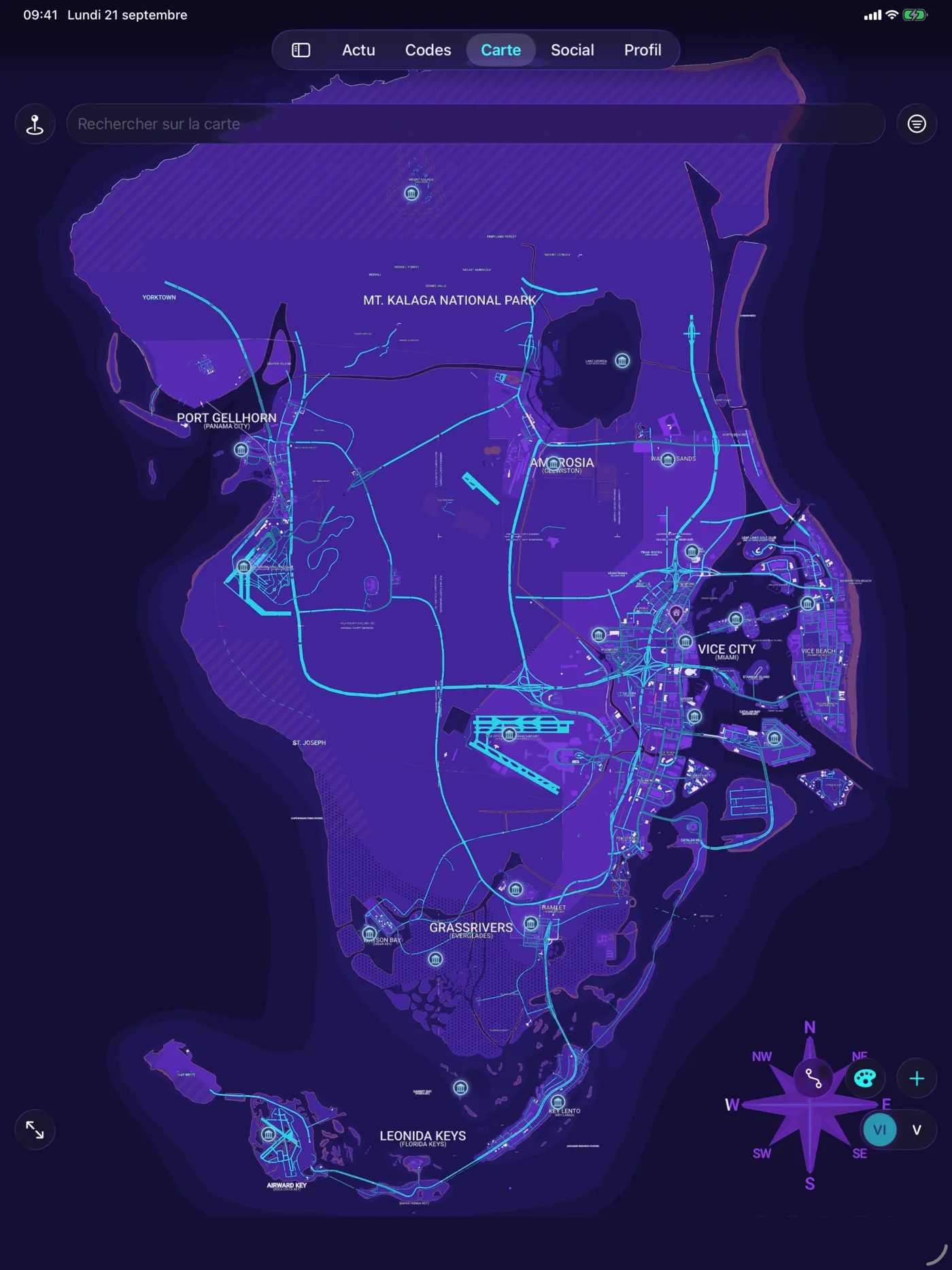 La carte sur iPad : l'île entière en violet et cyan, avec ses épingles de lieux, occupe tout l'écran de la tablette.